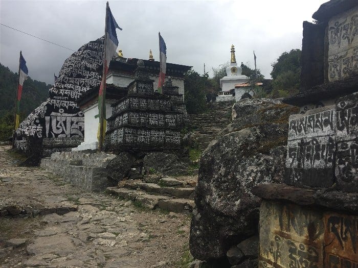 Countless stones carved with scriptures and religious texts surround this Stupa on the trail between Lukla Town and Namche Bazaar