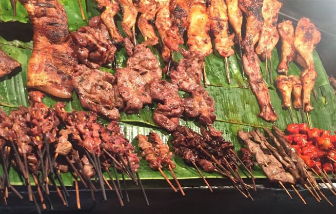 The street meat in Chiang Mai, Thailand includes some delicious things...but their are some oddities hidden among them...like pig intestines and "mud cutters". Can you spot them?