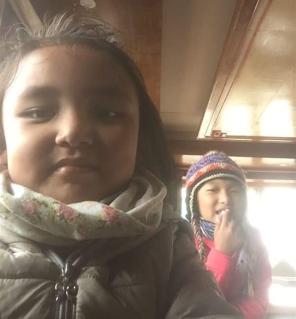 Pheriches Edelweiss welcome staff teaching me how to properly take a selfie - they demanded help with their English homework as payment. On the Everest Base Camp Hike between Tengboche and Gorak Shep