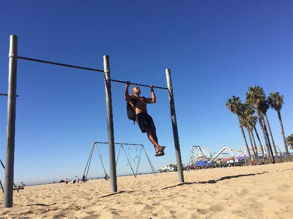 A simple pull up bar and weighted backpack recreate lat pull downs in the gym and offer an amazing biceps workout