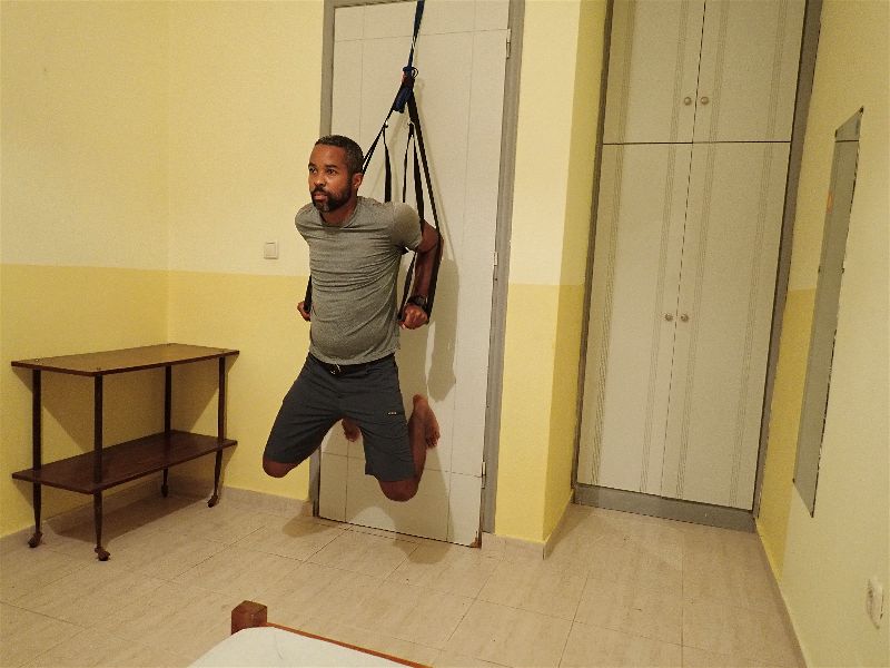 The suspension trainer also allows me to do dips, another essential upper body movement, as part of my hotel room workout